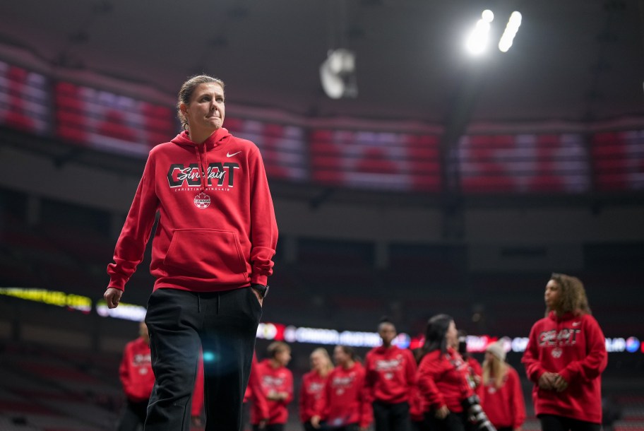 Christine Sinclair and teammates in "Sinclair GOAT" sweaters before the match