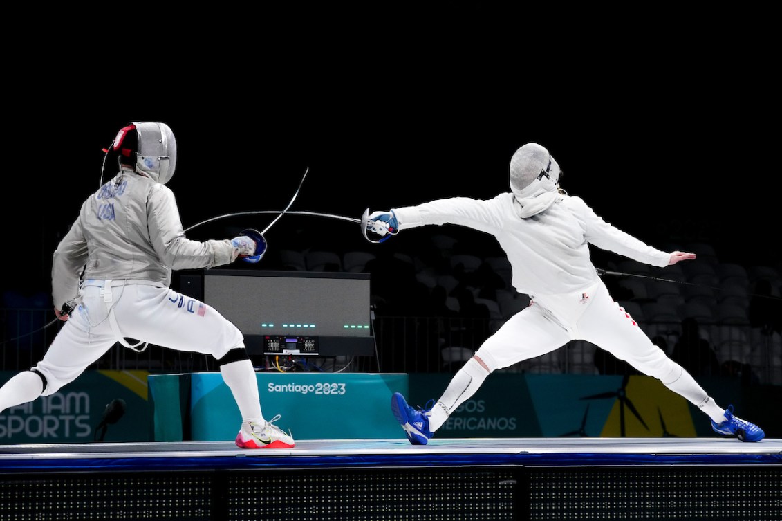 Two fencers duel