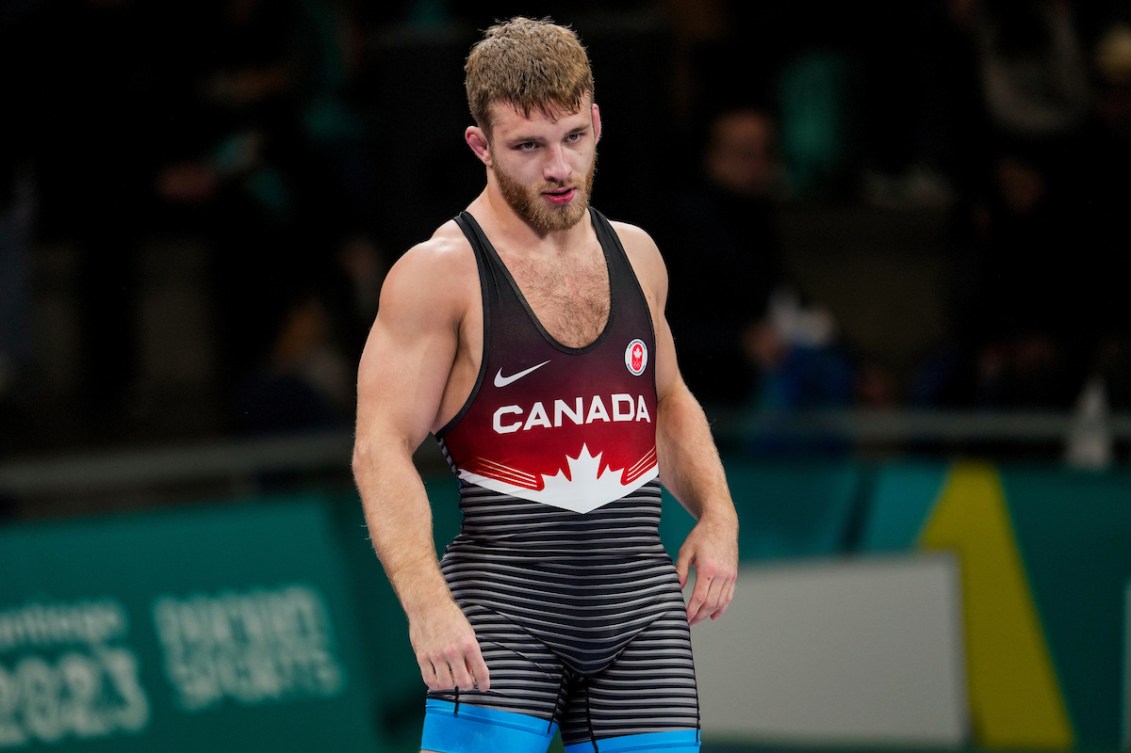 Wrestler wearing a singlet that says Canada
