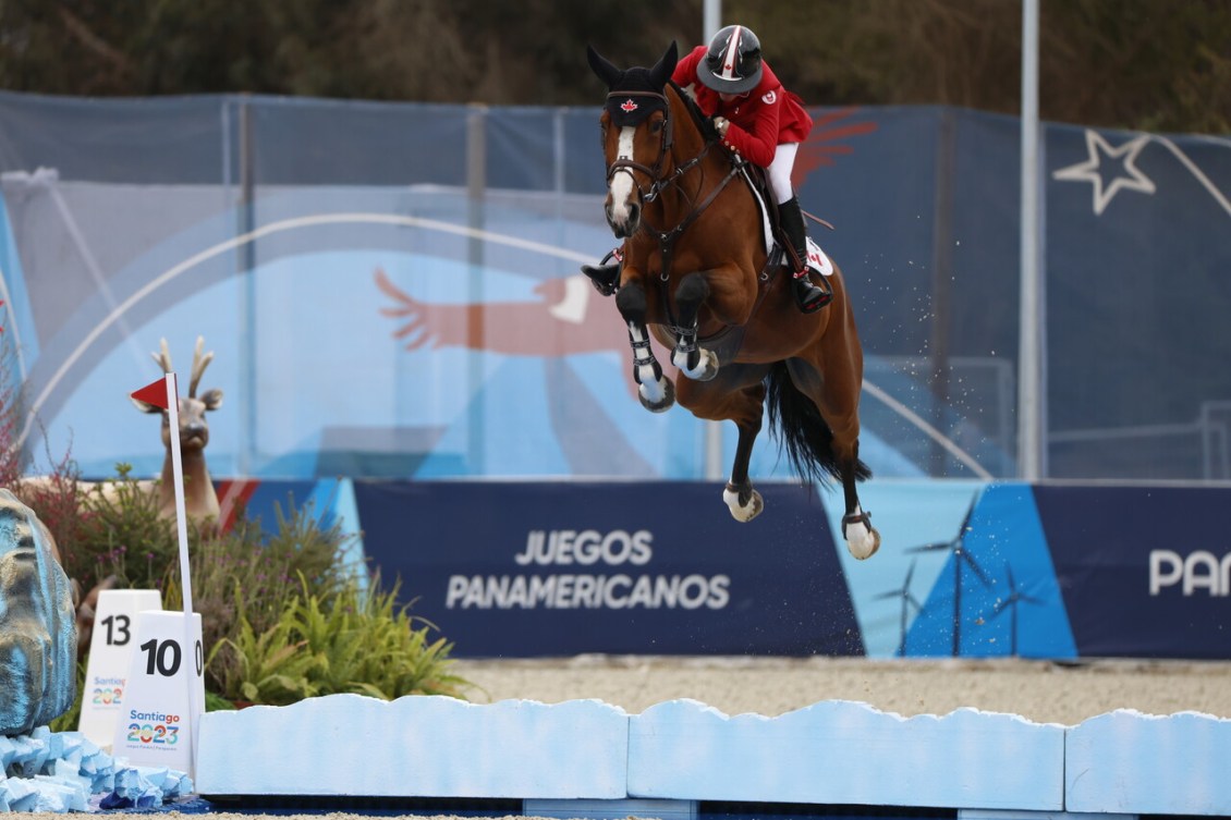 Beth Underhill and her horse clear a barrier