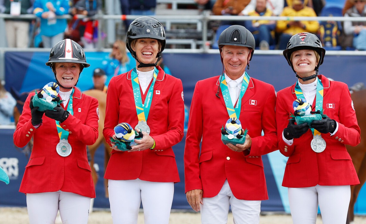 Team Canada equestrians pose with their silver medals at the Pan Am Games