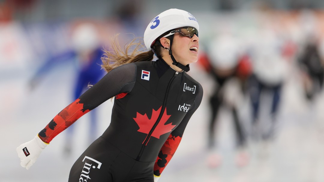 Valérie Maltais celebrates crossing the line