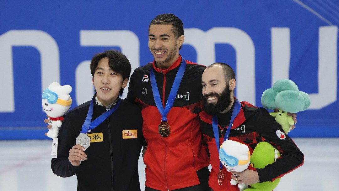 From left, silver medalist Park Ji-won of South Korea, gold medalist William Dandjinou of Canada and bronze medalist Steven Dubois of Canada pose during the award ceremony for the men's 1,500-meter (2) at the ISU World Cup Short Track Speed Skating Championships in Seoul, South Korea, Sunday, Dec. 17, 2023. (AP Photo/Ahn Young-joon)