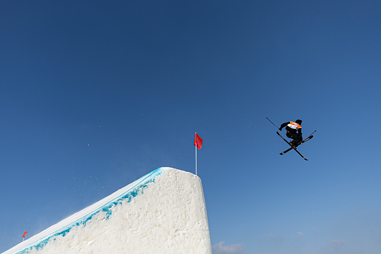 Freestyle skier performs a big air trick 