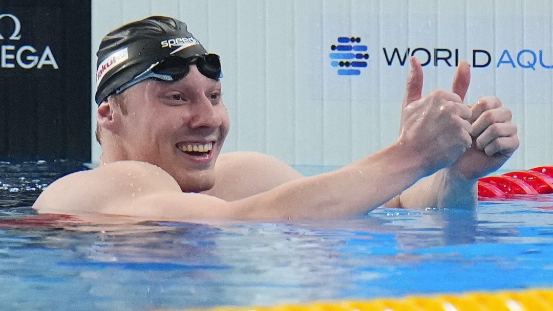 Finlay Knox gives two thumbs up while in the pool