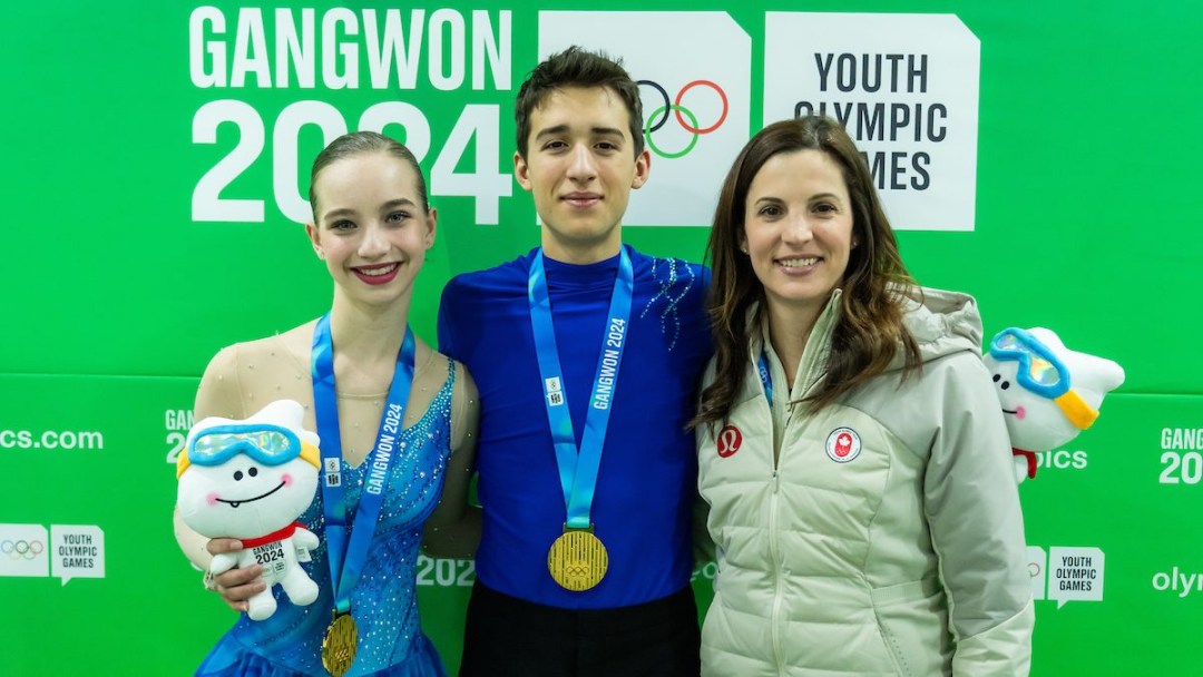 Lisa Weagle poses with gold medallists in pairs figure skating