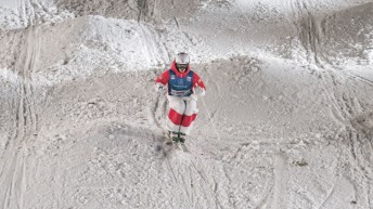 Mikael Kingsbury skis through moguls bumps