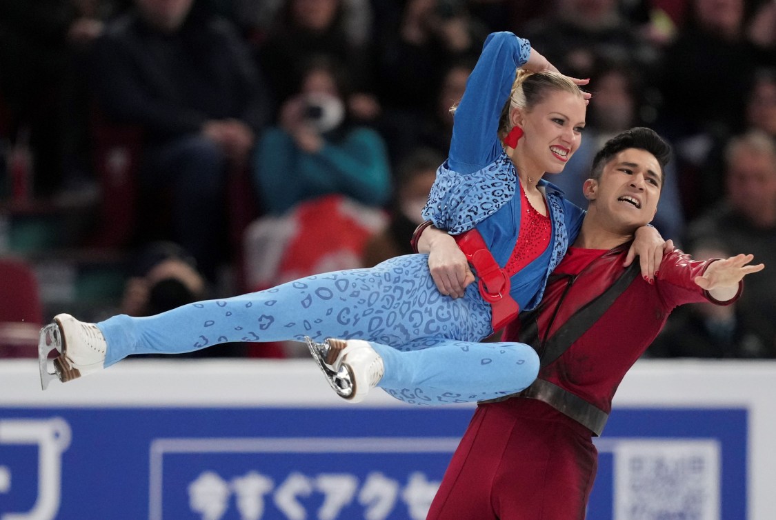 Zachary Lagha swings Marjorie Lajoie to the side in a lift 