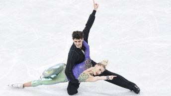 Piper Gilles and Paul Poirier in their closing pose of their program