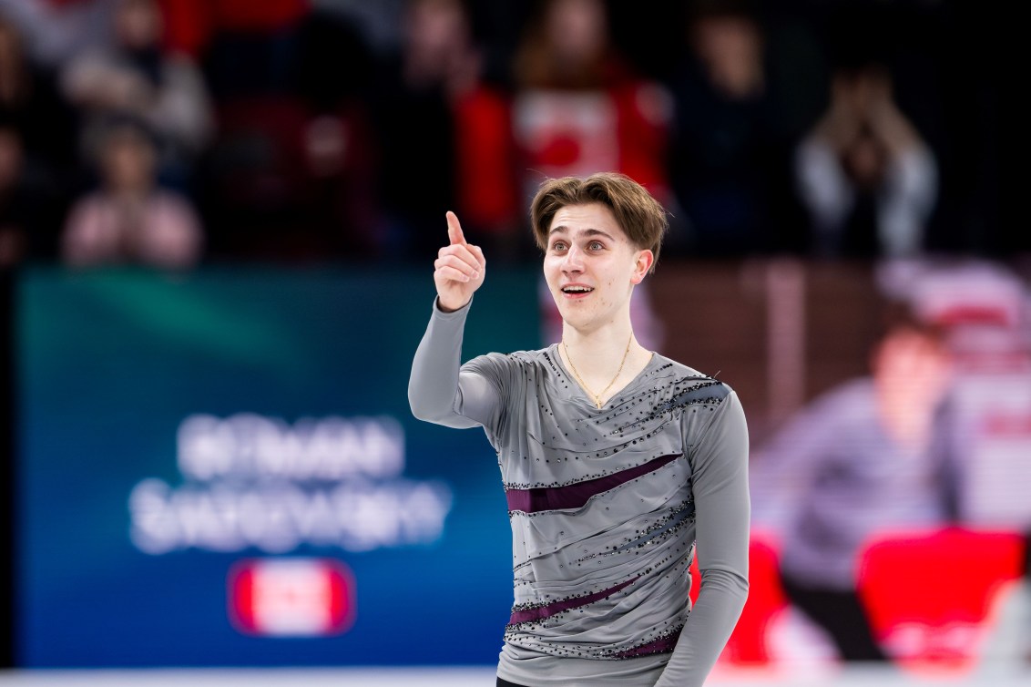 Roman Sadovsky points towards the crowd as he skates off the ice 