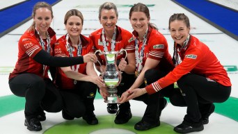 Canada skip Rachel Homan, left to right, Tracy Fleury, Emma Miskew, Sarah Wilkes and Rachel Brown celebrate after defeating Switzerland's Silvana Tirinzoni rink at the World Women's Curling Championship gold medal game in Sydney, N.S. on Sunday, March 24, 2024. THE CANADIAN PRESS/Frank Gunn