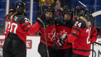 Canada's Renata Fast (14) celebrates her goal over Czechia with teammates during second period hockey action at the IIHF Women's World Hockey Championship in Utica, N.Y., Sunday, April 7, 2024. THE CANADIAN PRESS/Christinne Muschi