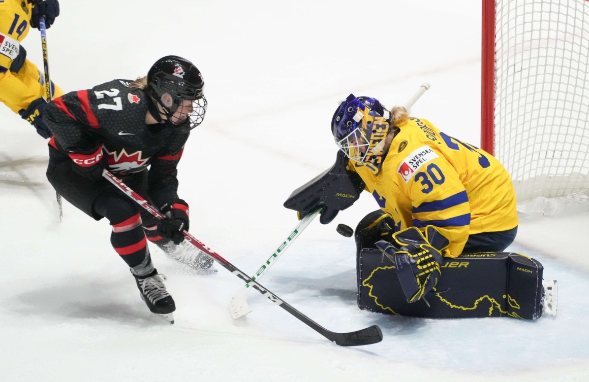 Sweden goaltender Emma Soderberg makes a save against Canada's Emma Maltais during first period quarterfinal hockey action at the IIHF Women's World Hockey Championship in Utica, N.Y., Thursday, April 11, 2024.