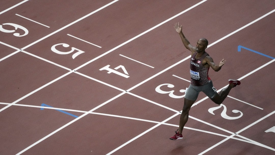 Damian Warner, of Canada, crosses the finish line in the decathlon 1500-meters during the World Athletics Championships in Budapest, Hungary, Saturday, Aug. 26, 2023. Warner finished second overall. (AP Photo/David J. Phillip)