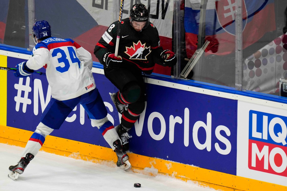 Slovakia's Peter Cehlarik challenges Canada's Michael Bunting during the quarterfinal match between Canada and Slovakia at the Ice Hockey World Championships in Prague, Czech Republic, Thursday, May 23, 2024. (AP Photo/Petr David Josek)