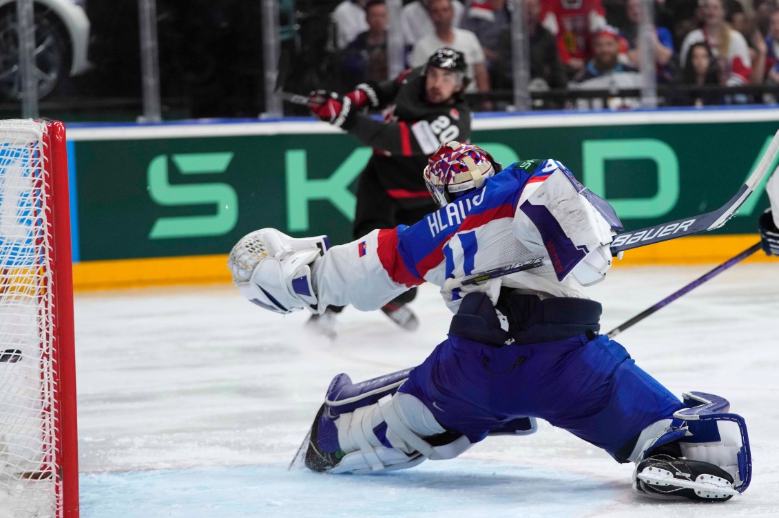 Slovakia's goalkeeper Samuel Hlavaj fails to make save against Canada's Nick Paul during the quarterfinal match between Canada and Slovakia at the Ice Hockey World Championships in Prague, Czech Republic, Thursday, May 23, 2024.