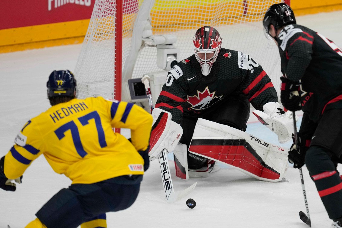 Canada's goalkeeper Jordan Binnington makes a save in front of Sweden's Victor Hedman during the bronze medal match between Sweden and Canada at the Ice Hockey World Championships in Prague, Czech Republic, Sunday, May 26, 2024.