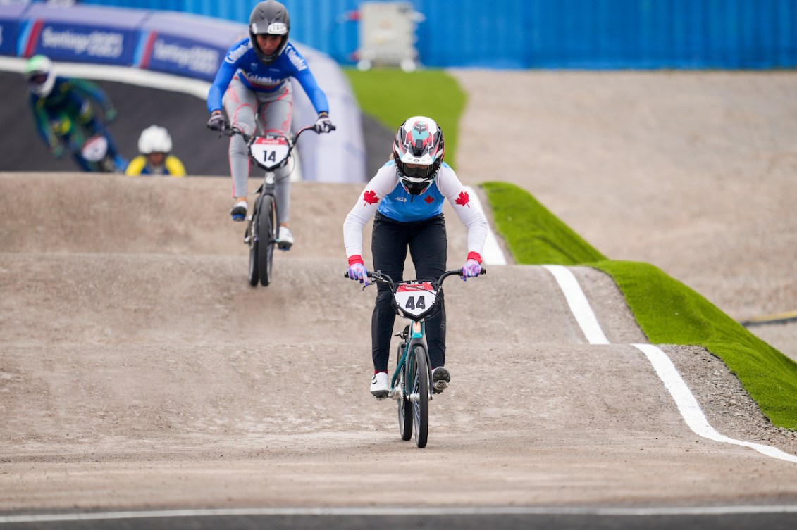 Molly Simpson sprints away from her BMX competitors