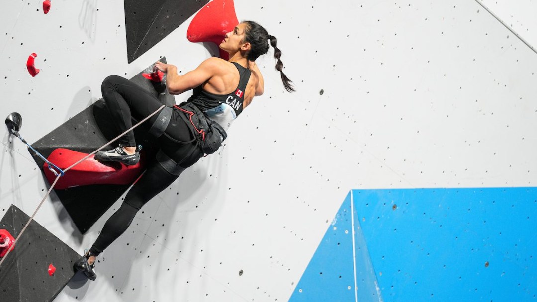 Sport climber Alannah Yip competes on the climbing wall at Santiago 2023.