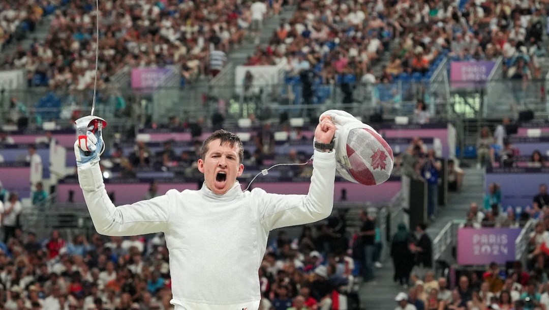 Team Canada’s Oliver Desrosiers reacts in celebration during the fencing sabre team match against Team Egypt at the 2024 Paris Olympics Games in France