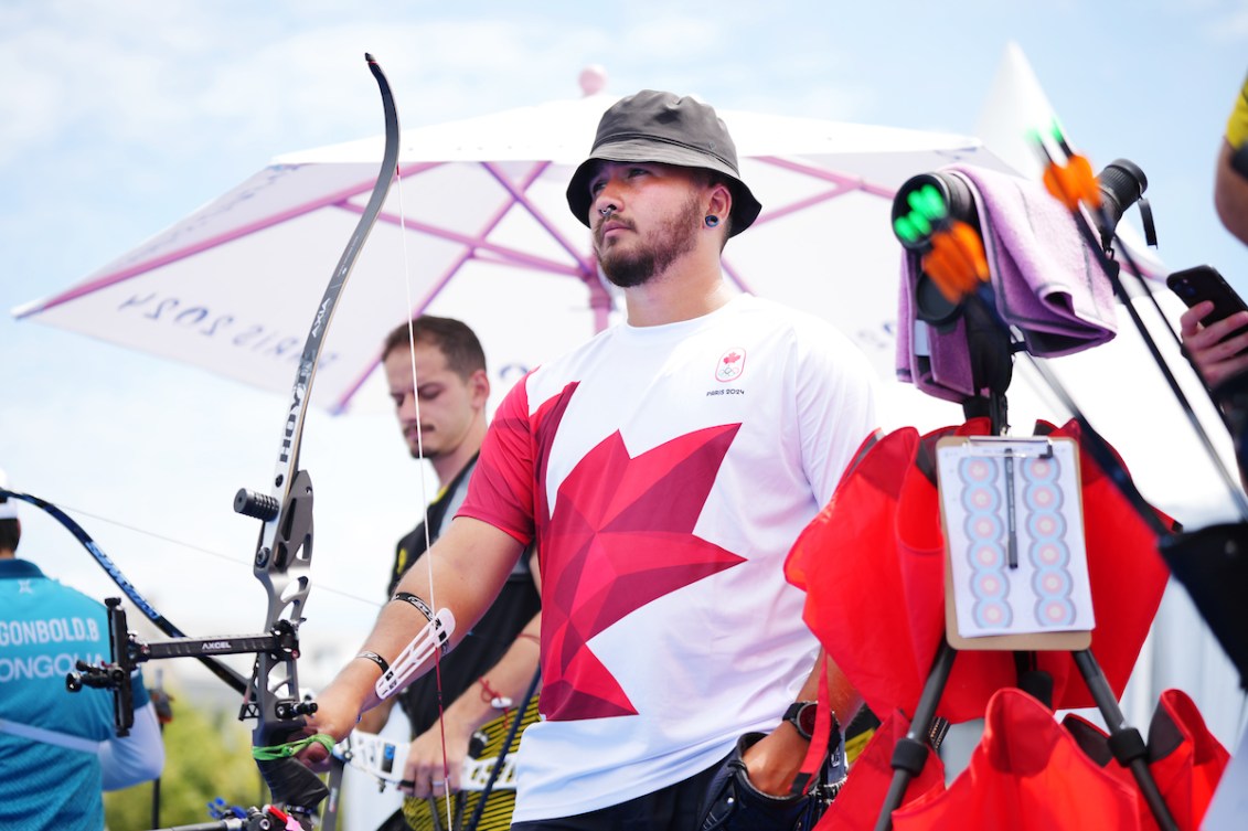 Eric Peters holds his bow