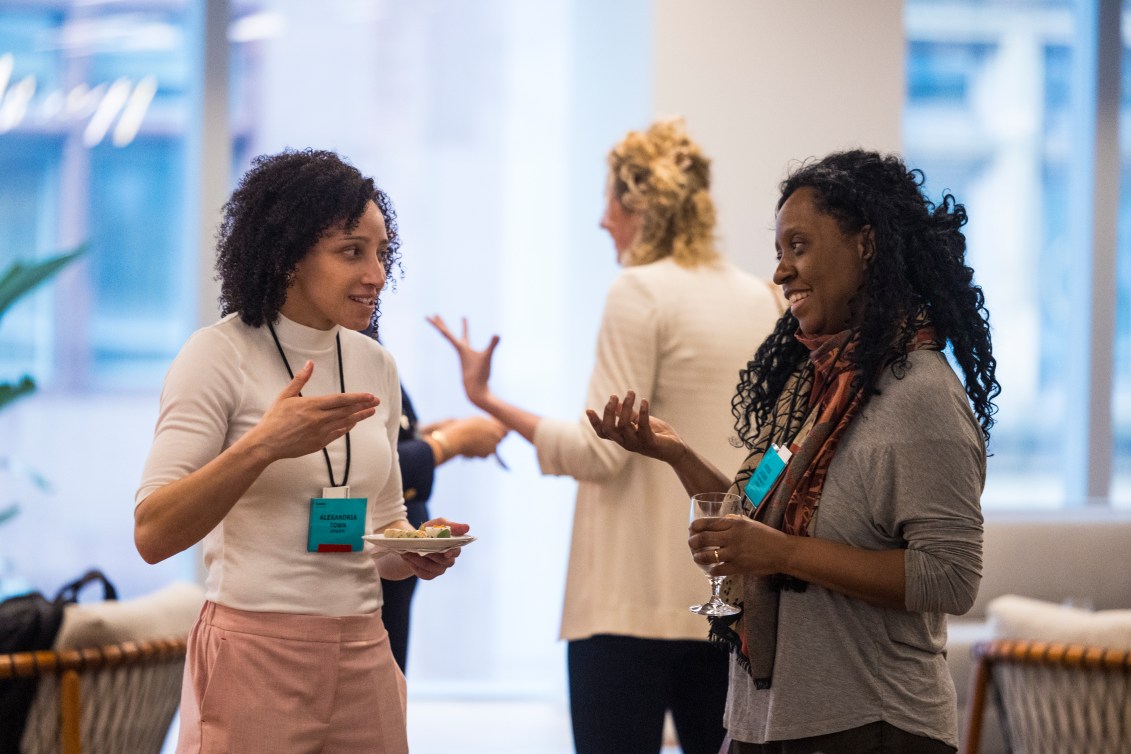 Two people chat at Game Plan Day in Canada