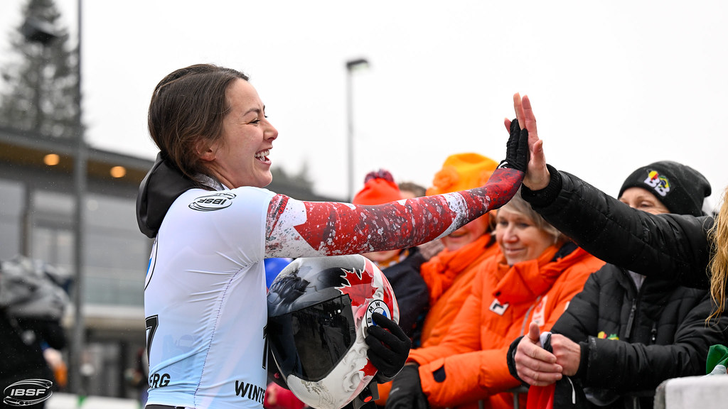 Jane Channell gives a high five to fans
