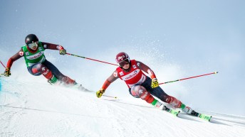 India Sherret and Marielle Thompson lean to the right while skiing