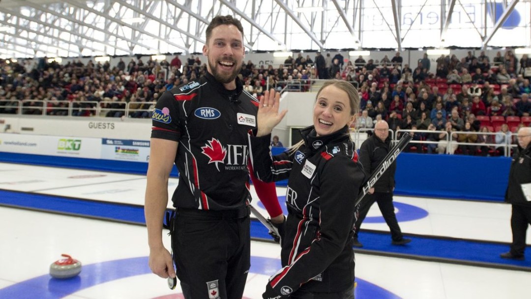 Jocelyn Peterman and Brett Gallant smile and celebrate