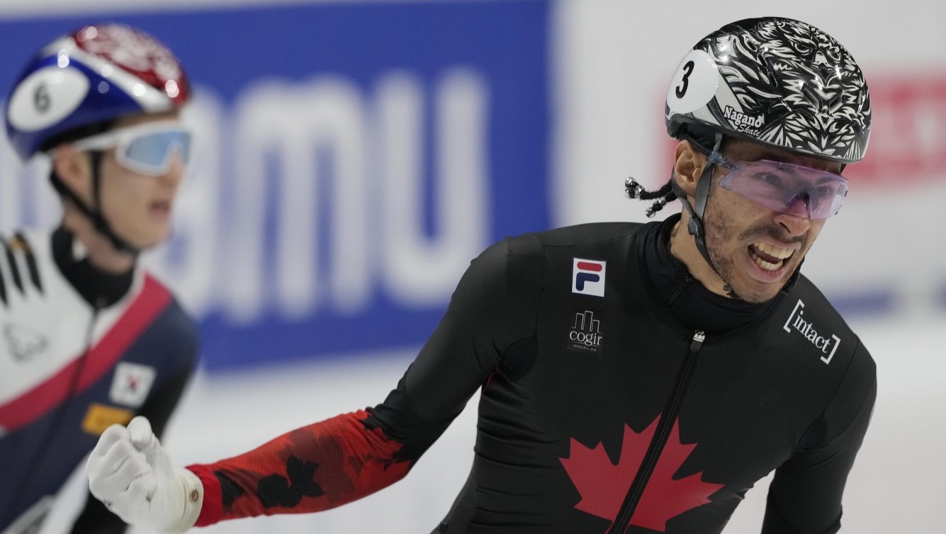 Canada's William Dandjinou celebrates after winning the gold medal in the men's 1000 meters final of the ISU Short Track World Tour and Olympics Milano-Cortina 2026 test event, in Milan, Italy, Sunday, Feb. 16, 2025.