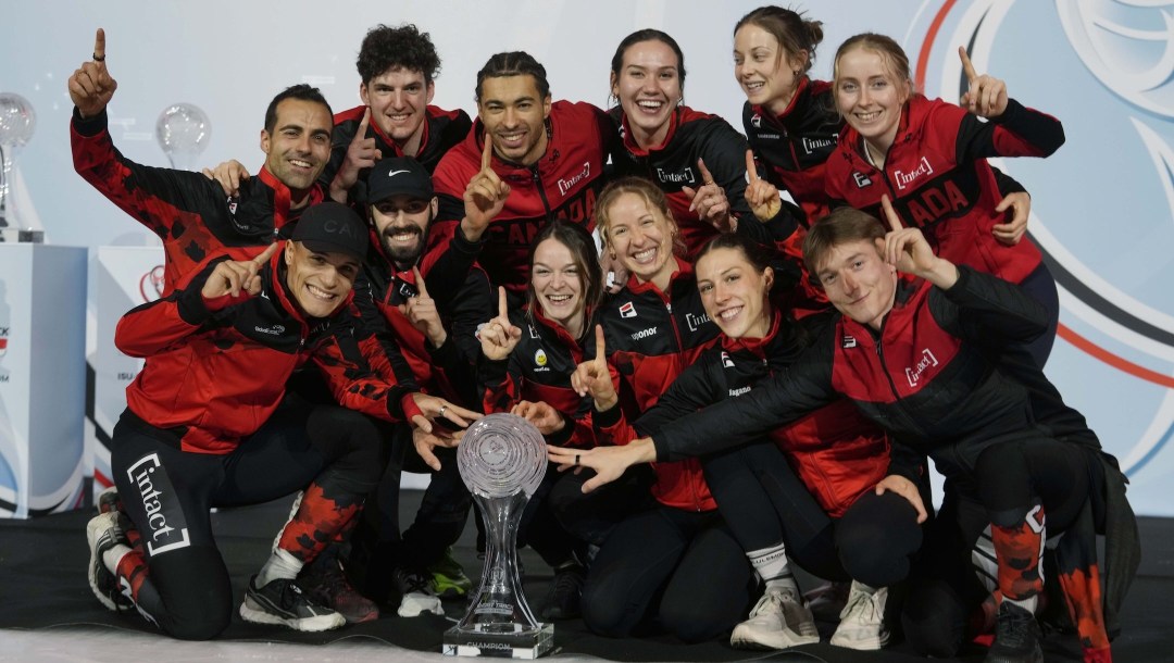 Canada mixed teams poses with the Crystal Globe trophy after winning the Teams overall World Cup, at the end of the ISU Short Track World Tour and Olympics Milano-Cortina 2026 test event, in Milan, Italy, Sunday, Feb. 16, 2025. (AP Photo/Luca Bruno)