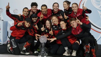 Canada mixed teams poses with the Crystal Globe trophy after winning the Teams overall World Cup, at the end of the ISU Short Track World Tour and Olympics Milano-Cortina 2026 test event, in Milan, Italy, Sunday, Feb. 16, 2025. (AP Photo/Luca Bruno)