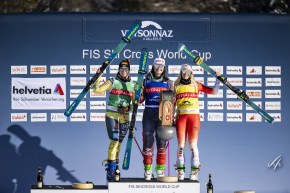 Marielle Thompson (centre) wins gold for Canada in ski cross