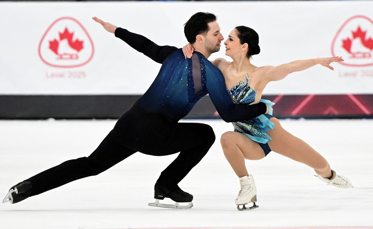 Deanna Stellato-Dudek and Maxime Deschamps perform a pair spin
