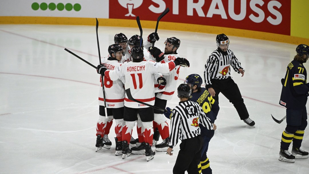 Canada's Travis Sanheim (#6) celebrates his goal with team mates during the IIHF Ice Hockey World Championship group A match between Sweden and Canada at Avicii Arena in Stockholm, Tuesday, May 20, 2025. (Fredrik Sandberg/TT via AP)