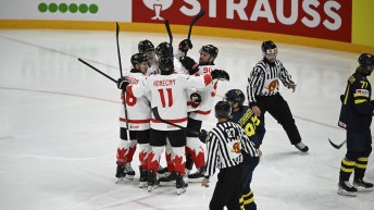 Canada's Travis Sanheim (#6) celebrates his goal with team mates during the IIHF Ice Hockey World Championship group A match between Sweden and Canada at Avicii Arena in Stockholm, Tuesday, May 20, 2025. (Fredrik Sandberg/TT via AP)