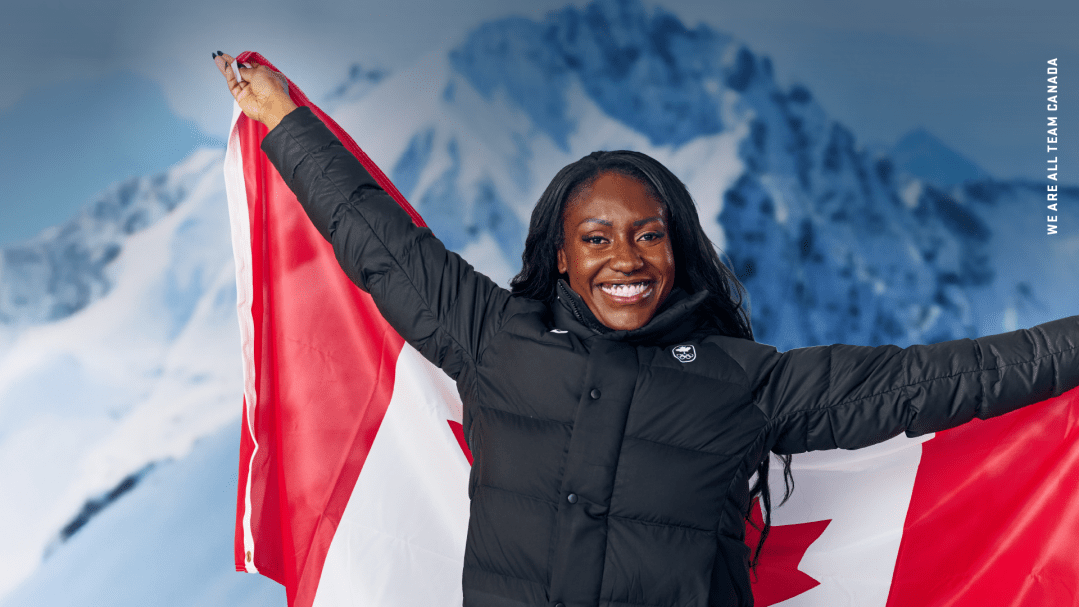 Cynthia Appiah holds a Canadian flag behind her back and smiles