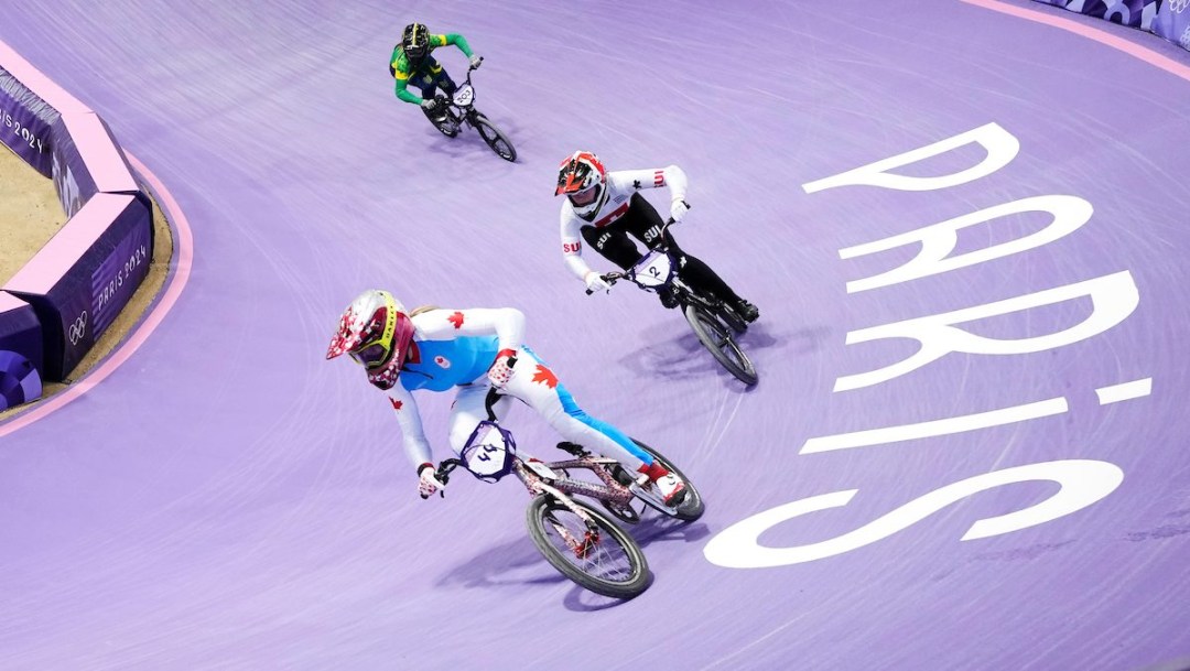 Molly Simpson races on the purple BMX track at Paris 2024
