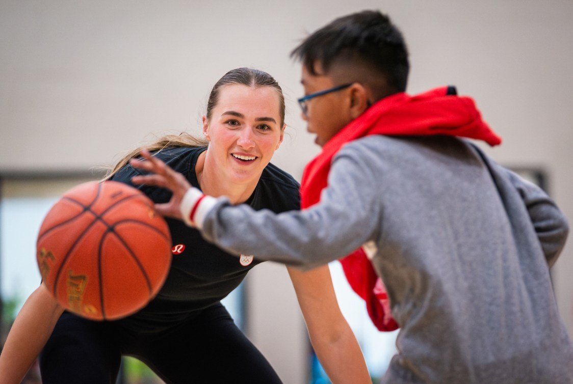 Paige Crozon plays basketball with students