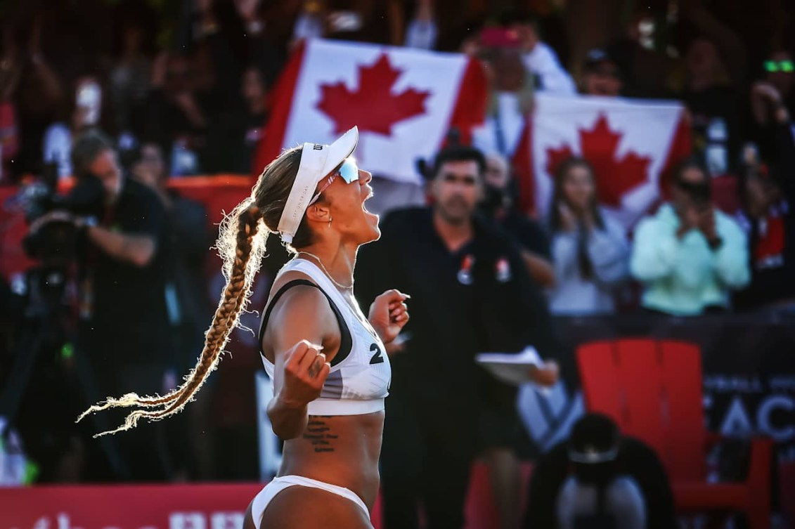 Brandie Wilkerson celebrates in front of fans holding Canadian flags