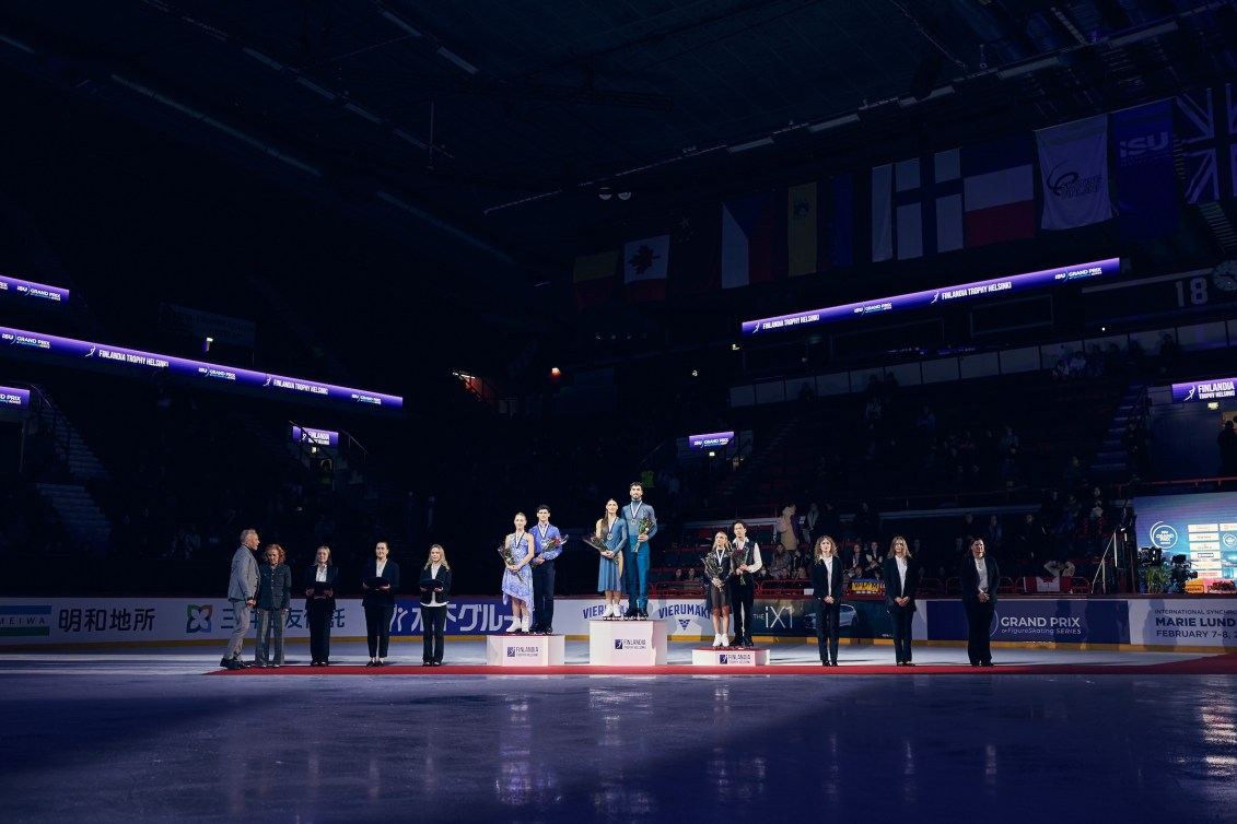 Piper Gilles and Paul Poirier, of Canada, on the podium at the 2025 Finlandia Trophy event in Finland, on Saturday, November 22, 2025. Photo by ISU Figure Skating Union. 