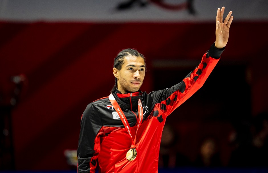 William Dandjinou of Canada celebrates after receiving gold medal in the 1500m race at the ISU Short Track World Tour speed skating event in Montreal on Saturday, Oct. 18, 2025. THE CANADIAN PRESS/Christopher Katsarov