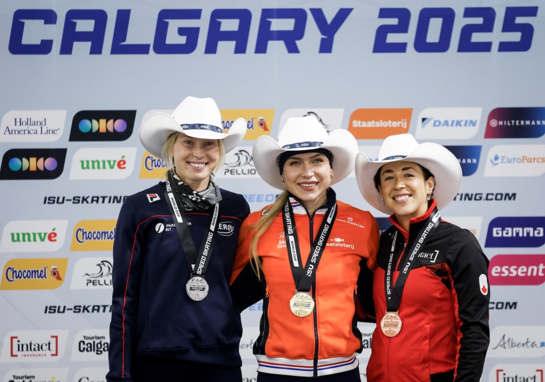 Joy Beune, centre, of the Netherlands, celebrates her victory with second place finisher Norway's Ragne Wiklund, left, and third place finisher Canada's Valerie Maltais on the podium following the women's 3000-metre competition during ISU World Cup speed skating in Calgary, Alta., Friday, Nov. 21, 2025.THE CANADIAN PRESS/Jeff McIntosh