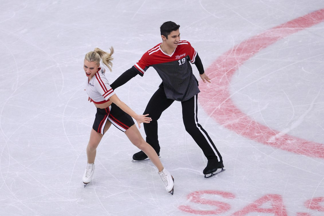 Marjorie Lajoie and Zachary Lagha wear tops that look like a jersey in hockey 