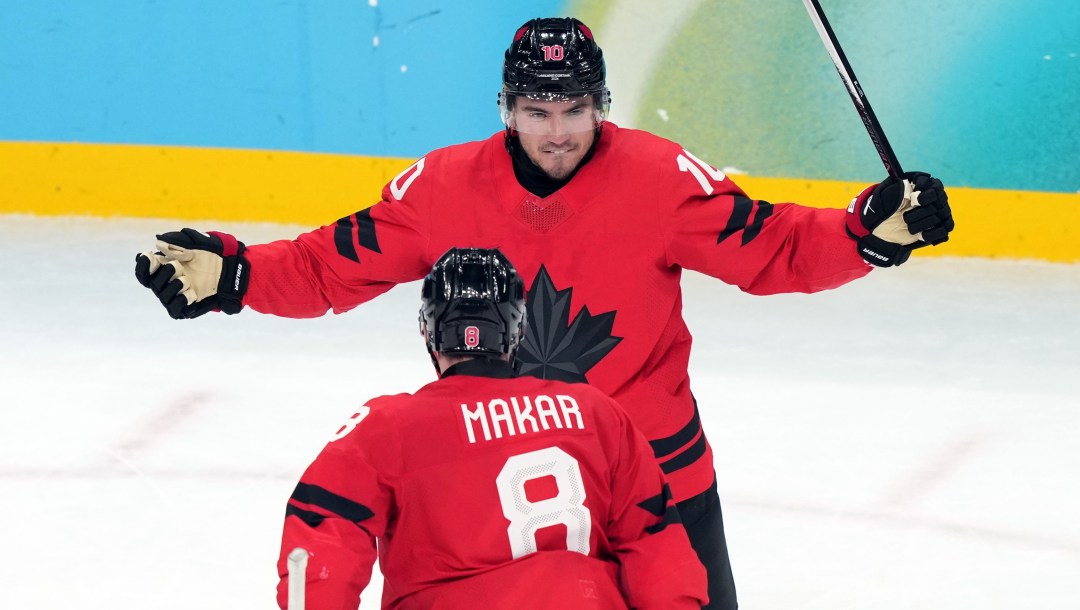 Nick Suzuki celebrates a goal.