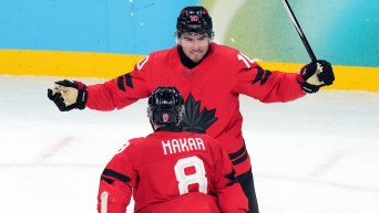 Nick Suzuki celebrates a goal.
