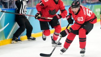 Brad Marchand competes in ice hockey.