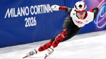 William Dandjinou competes in short track speed skating.