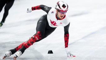 Félix Roussel competes in short track speed skating.