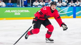Macklin Celebrini competes in ice hockey.